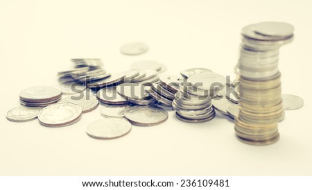 gold and silver coins thailand on white background with retro filter