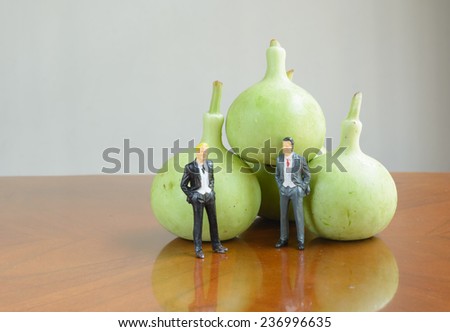 vegetable Thai winter melon with figure businessman on wood table