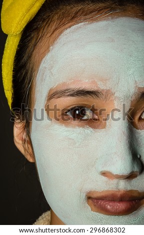 close up face asia girl treatment blue facial mask
