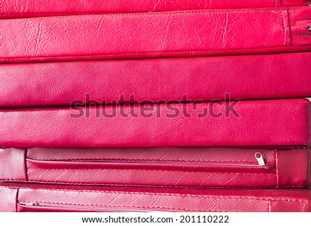 pile of red leather cushion texture background