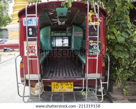 Chiangmai, Thailand - August 9: red minibus transportation service for tourist travelling all around Chiangmai city on August 9, 2014.