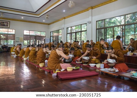 CHIANGMAI, THAILAND - SEPTEMBER 29: The buddhist monk have breakfast given by people who want to make great merit on September 29, 2014, in Arunyavivek temple, Maetang district of Chiangmai, Thailand.