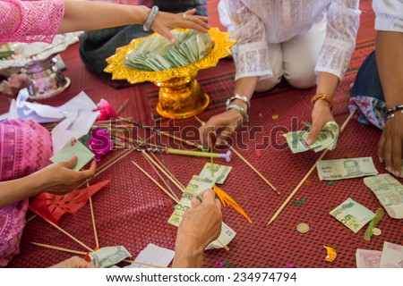 Chiangmai, Thailand - October 19, 2014: The people are counting twenty baht thailand banknote that people donate to the temple