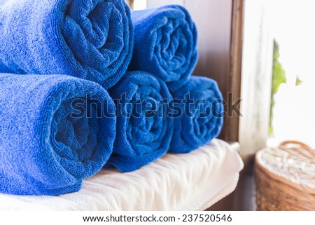 stack of folded blue towel for spa massage