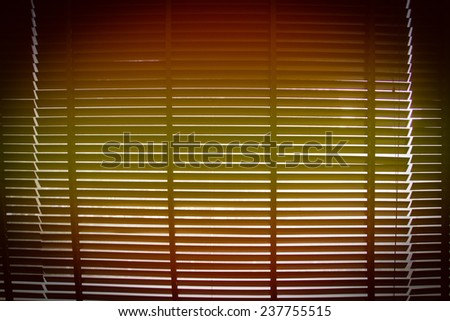orange and yellow gradient with vignette on horizontal sun blind or sunshade for background