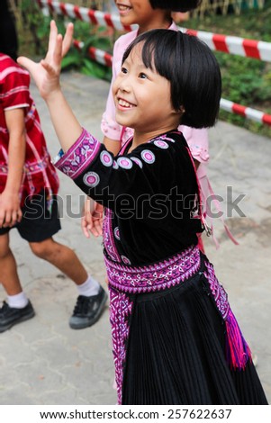 Chiangmai, Thailand - December 18, 2014: thailand hill tribe girl with traditional northern tribe costume in royal project fair at Chiangmai university.