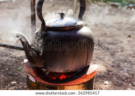 old kettle for boiling water on charcoal stove
