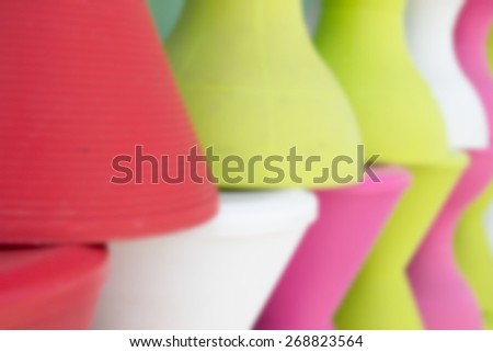 blurry defocused of pile of colorful plastic stool for background