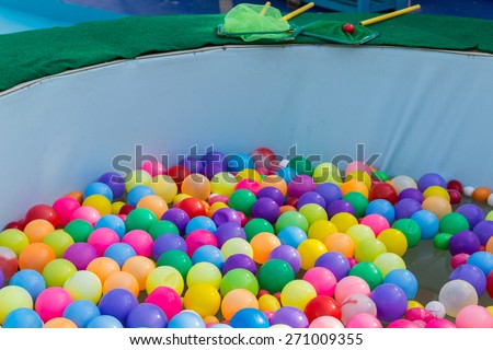 colorful plastic ball floating on water in the pool for games