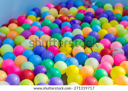 colorful plastic ball floating on water in the pool for games