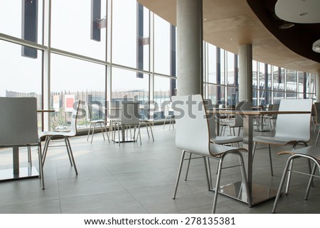white table and chair in food court