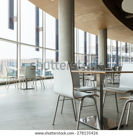 white table and chair in food court