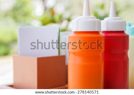 bottle of tomato ketchup, chili sauce and mayonnaise