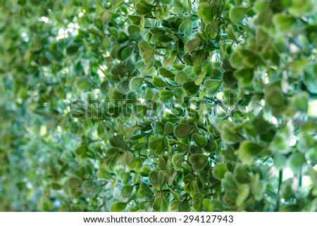 fake plant on wire fence for abstract texture background, shallow dept of field
