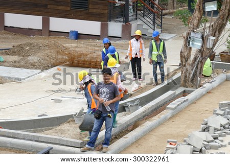 Chiang Mai, Thailand - July 25, 2015: The workers are constructing pathway at the construction site in Nirotharam temple.