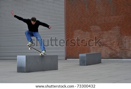 young man enjoys skateboarding in the streets.