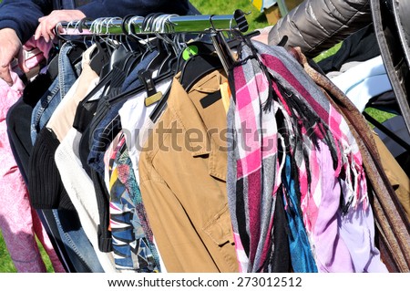 clothes on a rack at a flea market
