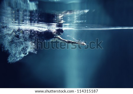 Professional Swimmer Crawl Underwater Isolated Blue Background