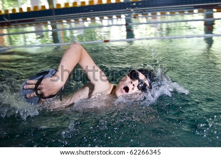 Boy swimming crawl taking breath