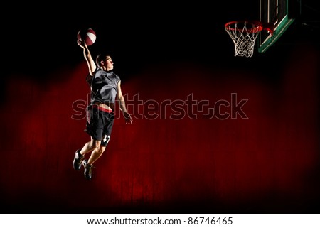 Basketball jump isolated on black red background