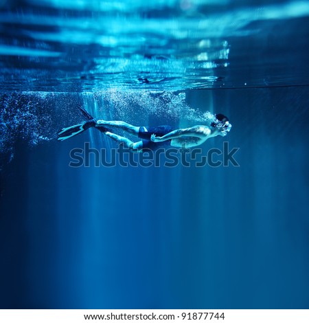 underwater diver isolated on blue background
