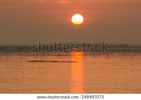 vintage photo of morning sun over in the sea