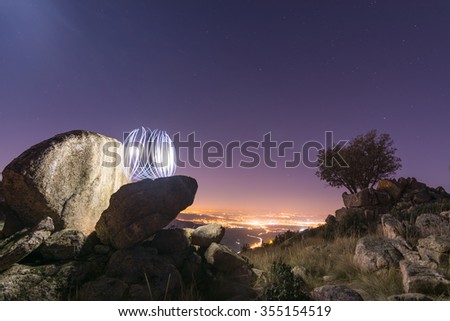 Abstract Light Painting sphere in a rock