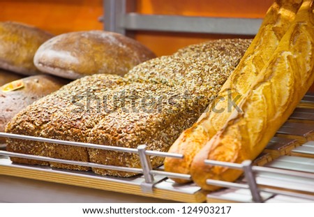 Bread and rolls exposed on sale on a shop show-window
