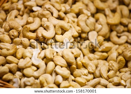 Background of sweet cashew nuts laying on counter