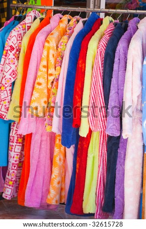 Colour terry dressing gowns in textile shop