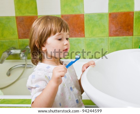 Personal hygiene. Care of an oral cavity. The girl brushes teeth.