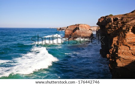 Stone arches at Playa de las Catedrales during high tide. The Bay of Biscay. Atlantic. Ocean. Spain