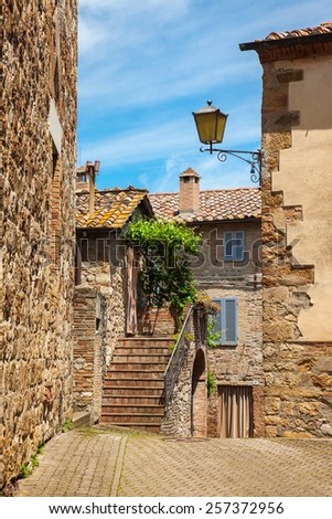Wall of the old house and ladder in the ancient Italian town, Tuscany