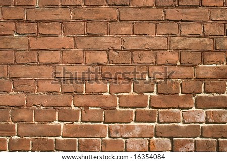 Wall ideally laid out by red bricks.