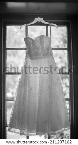 Wedding Dress in black and white - hanging before bride gets dressed
