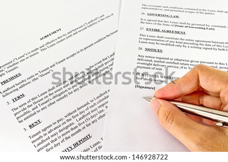 signing the contract to close a deal