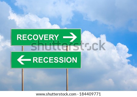 recovery and recession on green road sign with blue sky