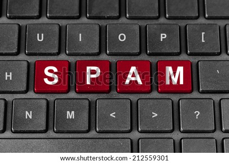 Spam red word on keyboard, technology concept