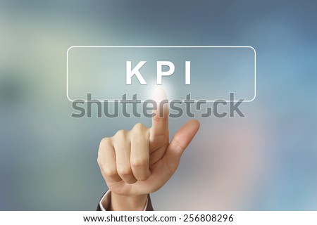 hand pushing KPI or Key Performance Indicator button