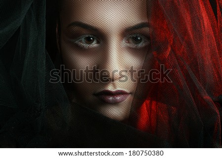 Mysterious Woman Portrait. Beautiful Model Woman Face Closeup