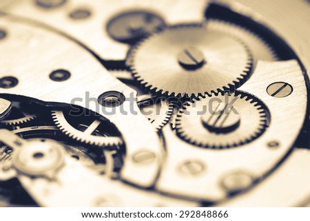 Mechanism of pocket watch with grunge texture.