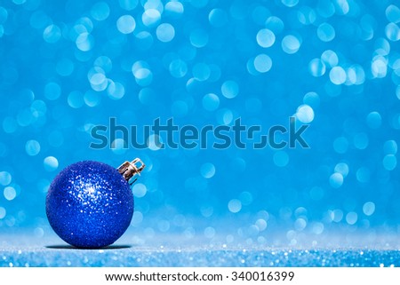 Beautiful Glitter christmas ball close-up on shining background