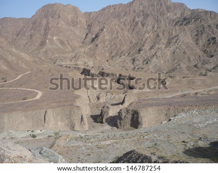 Wadi track cutting through the Al Hajar mountain range in middle east