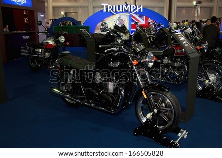 NONTHABURI - NOVEMBER 28: Motorcycle Triumph display at The 30th Thailand International Motor Expo on November 28, 2013 in Nonthaburi, Thailand.