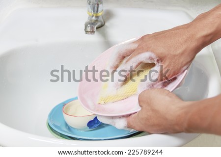 Man washing  dish.