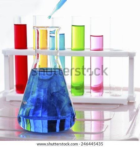 test tubes in a test on white background for symbolic photo for learning and researching.