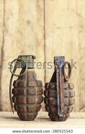 Grenade on old wood for background and texture