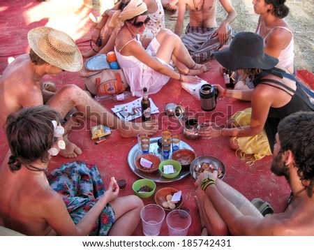 Aragon, Spain - July 10, 2009: A group of young people preparing tea during the Nowhere Festival.