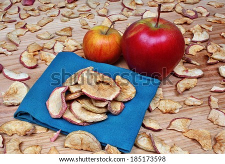 Dried apples on the blue fabric - the background of dried apple slices