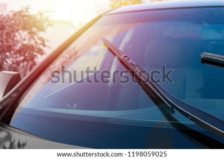 Brushes on the windshield with copy space. The concept of cleaning agent, polishing, nanocoatings
